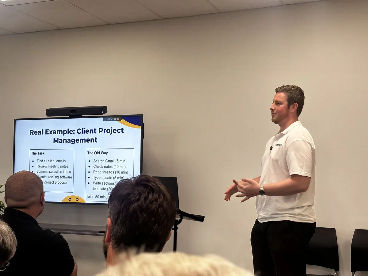 Blake Harkness presenting a real example of AI handling client project admin at Beyond Chatbots, Powerhouse Coworking, Christchurch