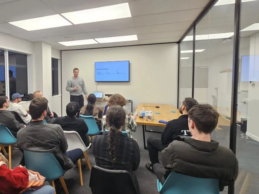 Blake Harkness presenting to a full room at the Young Kiwis in AI Palmerston North meetup
